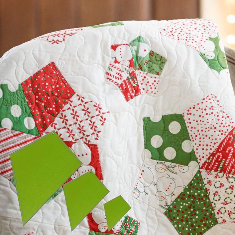 Christmas-themed patchwork quilt with red, green, and white patterns on a wooden surface.