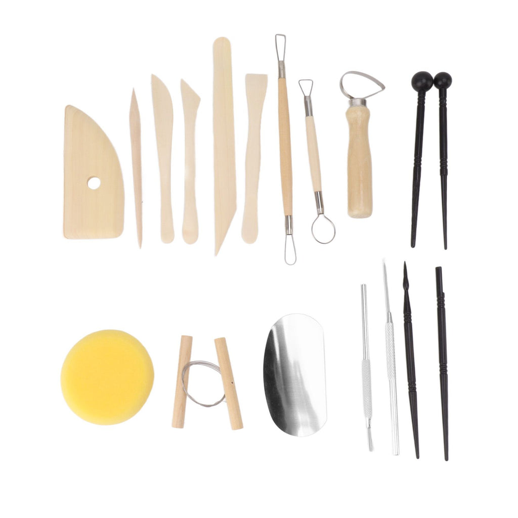 A pottery tool set arranged on a white background, including wooden sculpting knives and spatulas, metal loops and scrapers, pointed sculpting tools, a yellow sponge, and a polished stone or metal slab.