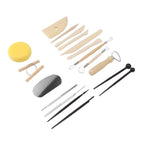 A pottery wheel throwing tool set arranged on a white background, including wooden sculpting knives, metal loops, a yellow sponge, a gray wheel roller, and black-handled tools.