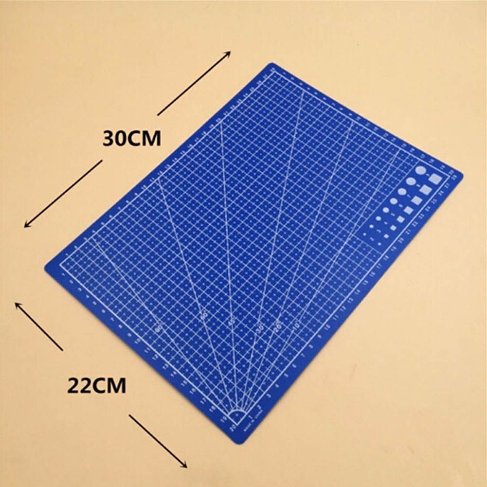 A blue cutting mat with a white grid and measurement markings, shown on a beige background with arrows and text indicating dimensions of 30CM by 22CM.