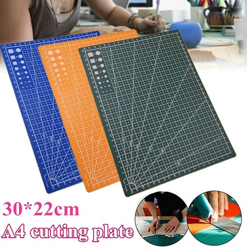 Three A4 cutting mats in blue, orange, and dark green are shown overlapping on a white background, with a person using a craft knife in the upper background and two circular inset photos at the bottom demonstrating the mats. Text reads '30*22cm A4 cutting plate'.