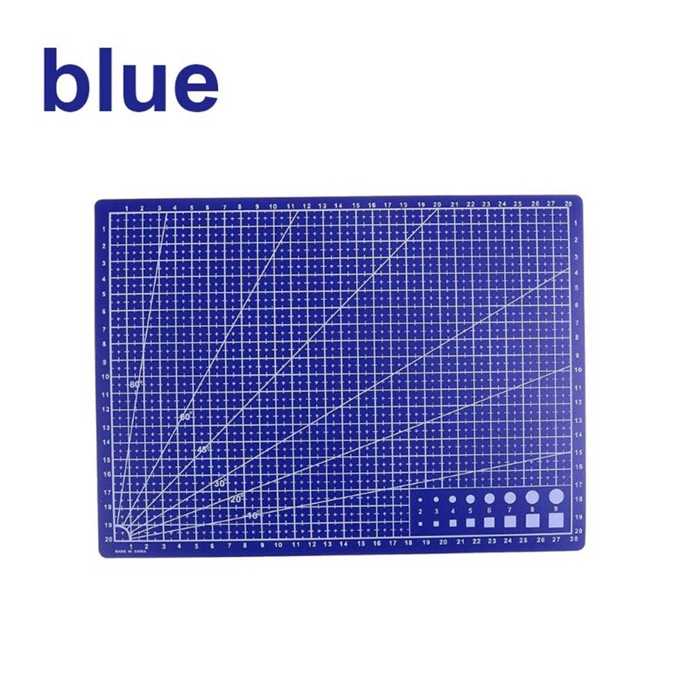 A blue cutting mat with white grid lines, angle guides, and a small set of circular and rectangular sample shapes in the bottom right corner, shown on a white background with the word 'blue' in the top left.