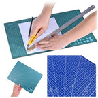 Green self-caling craft cutting mat shown with hands using a utility knife and metal ruler on white paper, plus inset views of the mat in teal and blue color options on a white background.

Details