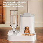 Automatic pet feeder with water dispenser on a wooden floor.