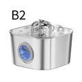 A stainless steel pet water fountain with a clear water spout and a blue gem-like accent on the front, shown on a white background with the text 'B2' in the upper left.
