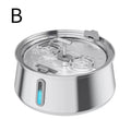 A stainless steel pet water fountain bowl with a clear glass lid, dual water jets, and a blue LED indicator light on the side, shown on a white background with a black letter 'B' in the top left.