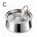 A stainless steel pet water fountain with a copper-colored handle and a clear water reservoir, shown with water flowing into the basin. A black letter 'C' is printed in the top-left corner on a white background.