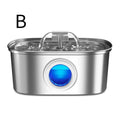 A stainless steel water filter pitcher with a clear lid, water-filled top chamber, and a prominent blue circular indicator window on the front, shown on a white background with a black letter 'B' in the upper left.

Details