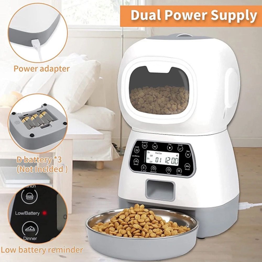White pet food dispenser with digital display and power adapter on a light wooden floor.