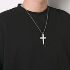 Man wearing the holy cross around his neck