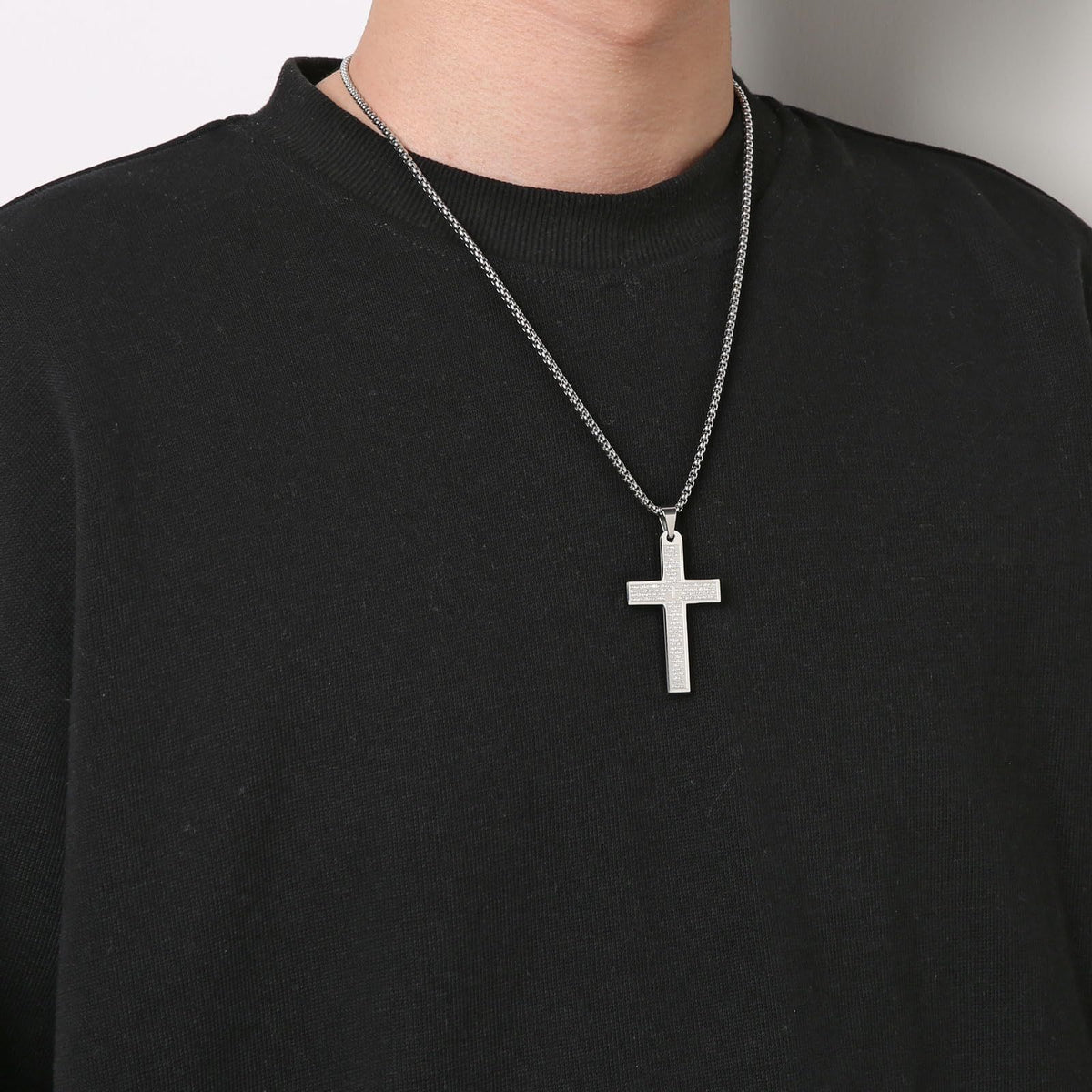 Man wearing the holy cross around his neck