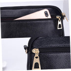 Black pebbled leather crossbody phone pouch with gold-tone hardware, shown in two views: one with a smartphone tucked into the zippered compartment, and a close-up of the zipper pull.