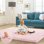 A child sits on a large pink play mat in a bright living room, playing with wooden blocks. A circular inset at the lower left shows a close-up of a foot stepping onto the mat.