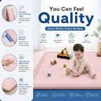 A pink baby play mat shown in a promotional infographic with feature callouts on the left and a baby sitting on the mat on the right. The text highlights qualities such as premium hand-stitched edges, non-slip bottom, high-density elastic foam, and built-to-last durability