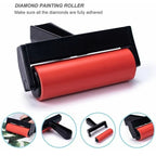 Diamond painting roller with red roller and black handle on a white background