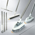 A set of flexible cleaning brushes and squeegees with long silver metal handles, white plastic joints, and gray bristles, shown on a light gray studio background with orange arrow accents indicating interchangeable heads