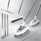 A set of flexible cleaning brushes and squeegees with long silver metal handles, white plastic joints, and gray bristles, shown on a light gray studio background with orange arrow accents indicating interchangeable heads