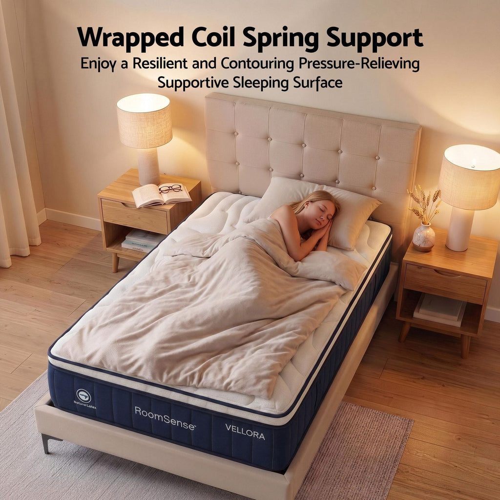 Woman sleeping on a Vellora mattress with 'Wrapped Coil Spring Support' text above.