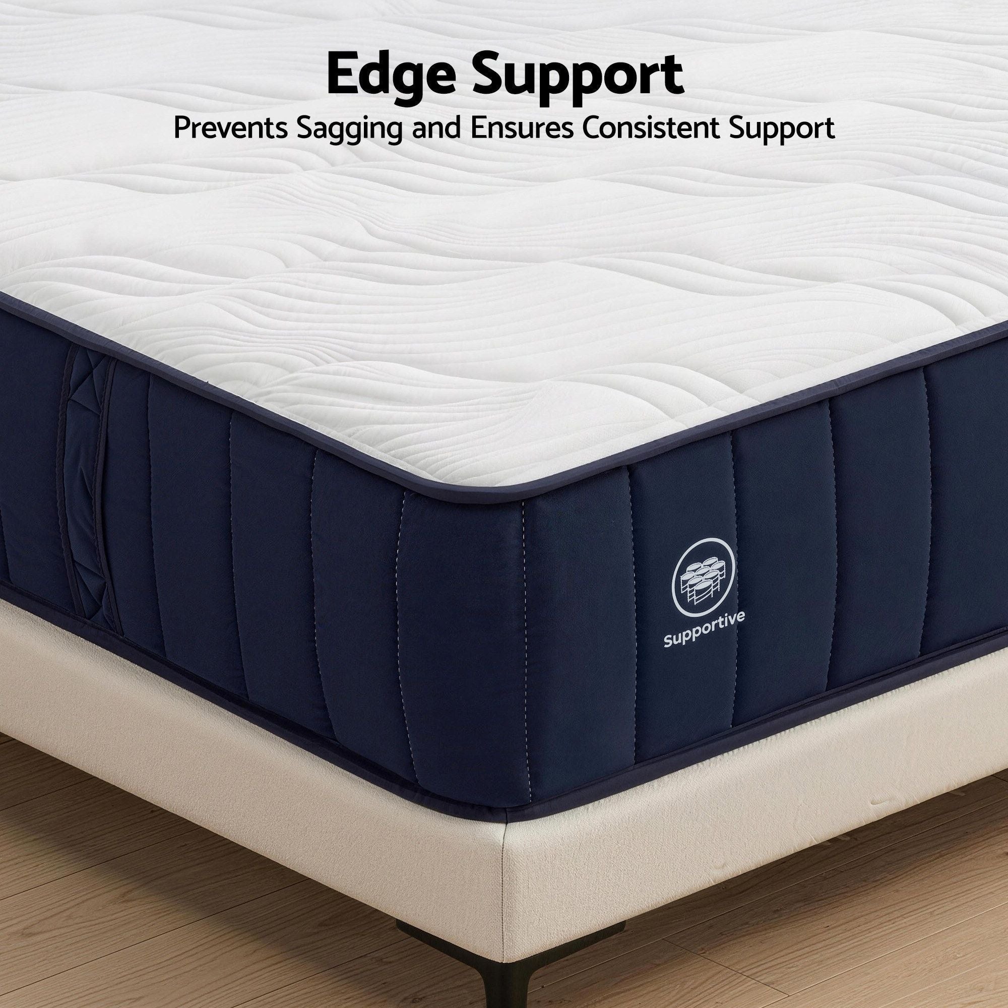 Navy blue mattress with white top on a wooden floor, featuring 'Supportive' branding.