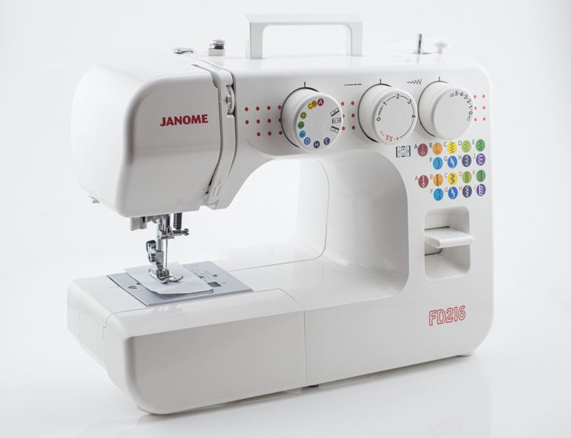 A white Janome FD-S15 sewing machine with colorful stitch selector buttons and white dials, photographed on a clean white background.