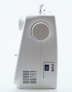 A white electric sewing machine shown from the side against a clean white background.