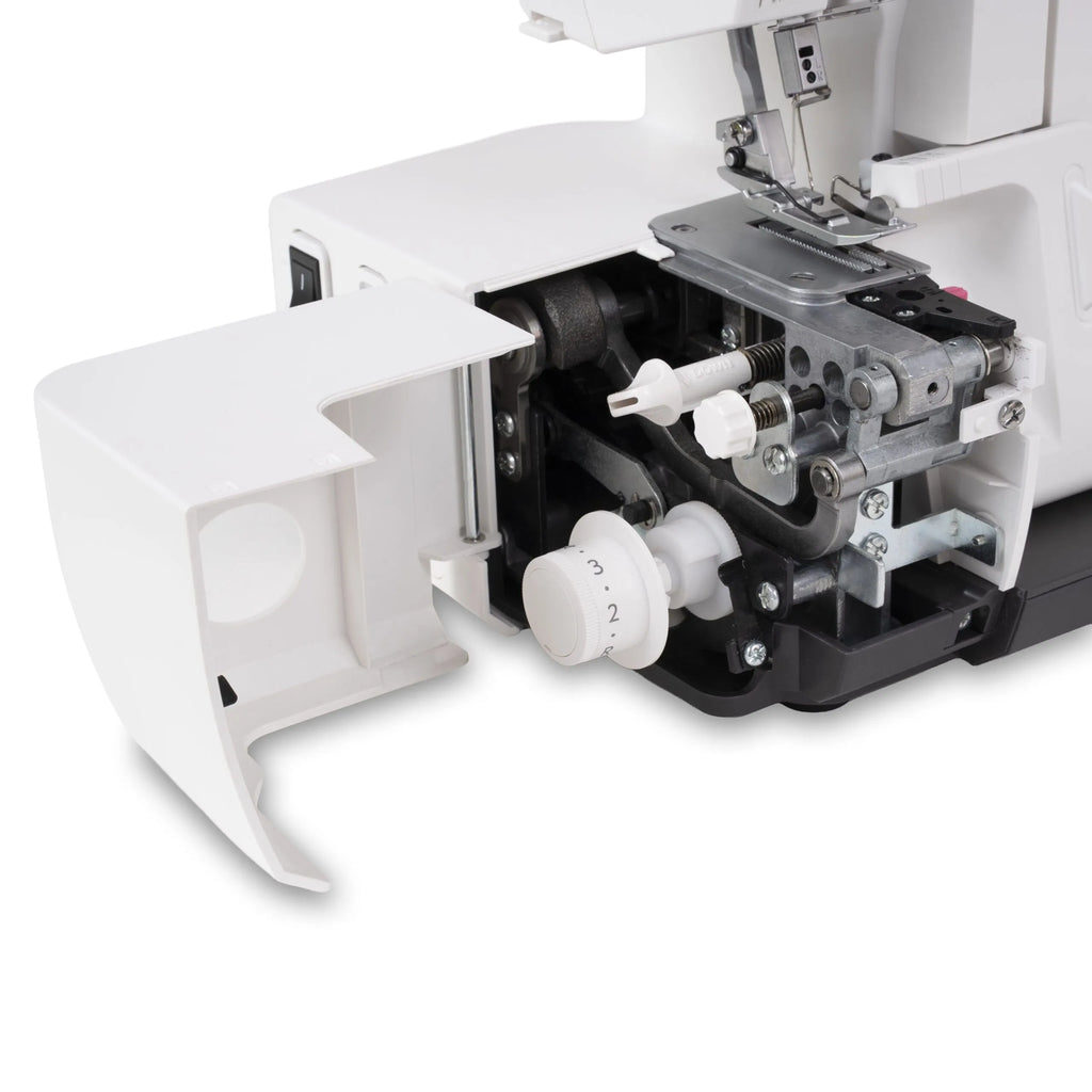 Close-up of a white and black sewing machine with built in overlocker showing internal mechanical components, a white dial, and a white protective cover swung open on a white background.