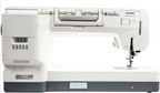rear view vision of a Janome sewing machine in white and dark gray, shown from a rear  angle against a solid white background.
