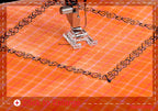 A close-up of a sewing machine foot stitching an orange fabric with a black decorative border pattern, shown with a dashed collage border and small text at the bottom.