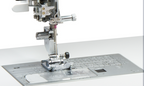 Close-up of a sewing machine presser foot and metal plate assembly on a white background.